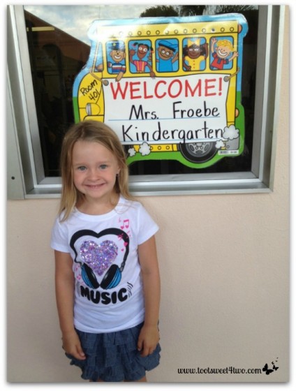 Princess P posing outside her kindergarten classroom