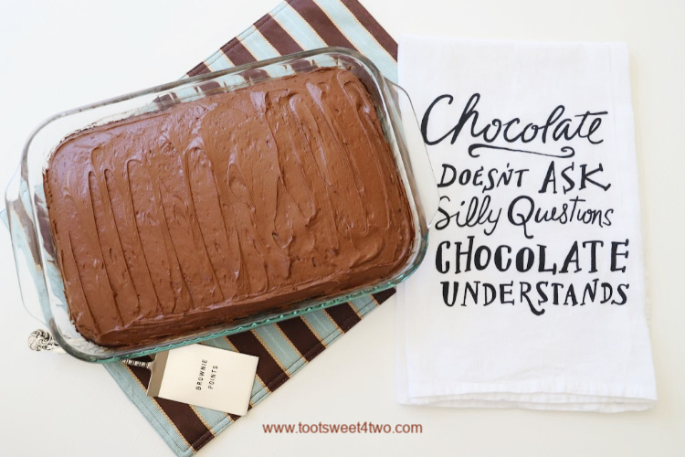 beautiful crazy chocolate cake in a glass baking pan on a striped placemat