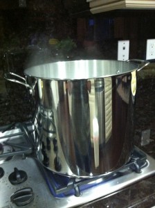 Pot of boiling corn cobs