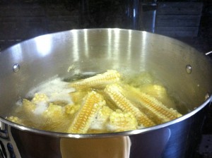 Boiling corn cobs
