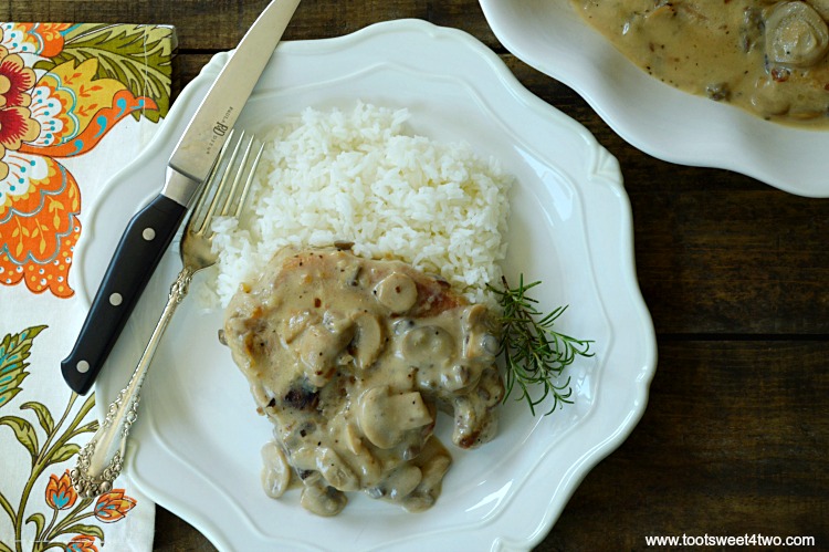 close-up of cream of mushroom pork chops served with white rice on a plate