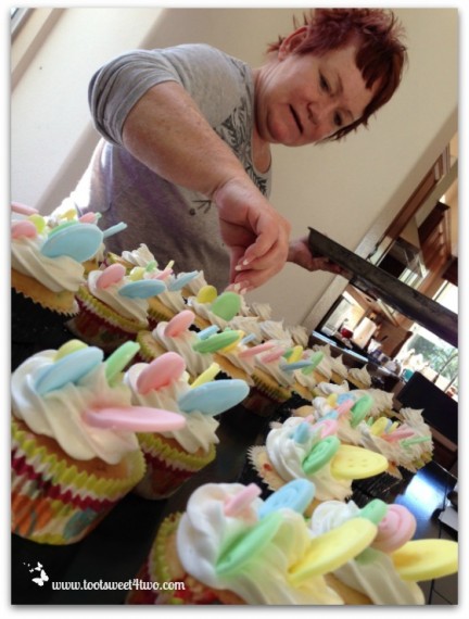 Patti adding Buttons to cupcakes