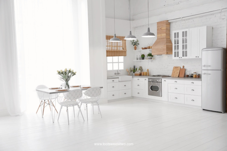 beautiful white kitchen with striking wooden stovetop hood
