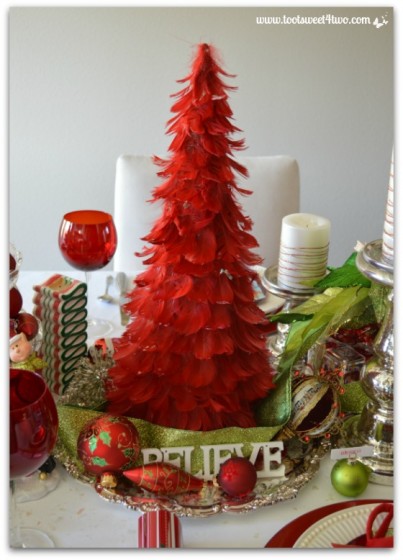 Red feather tree on a silver platter