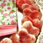 Heart-shaped pie crust cookies made with store-bough dough sprinkled lavishly with sugar and sprinkles.