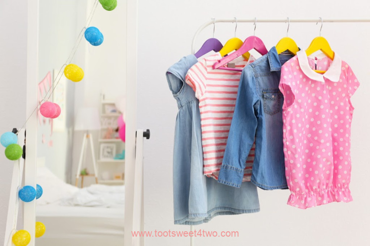 inside a little girl's closet with hanging clothes