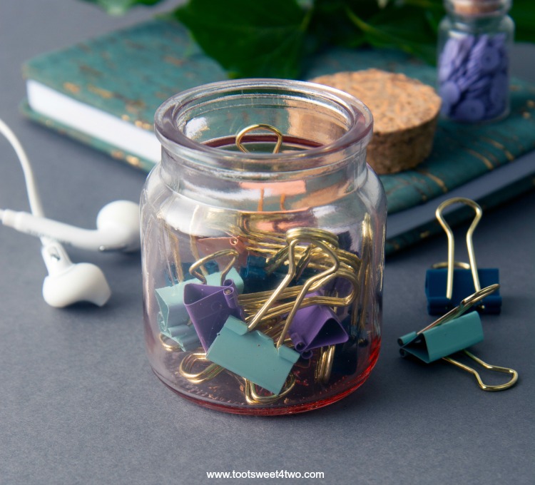 Image of a glass jar with binder clips inside