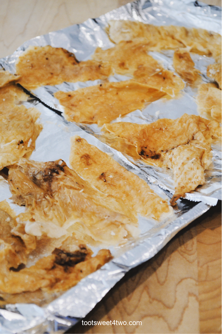 close-up of leftover turkey skin on a baking sheet
