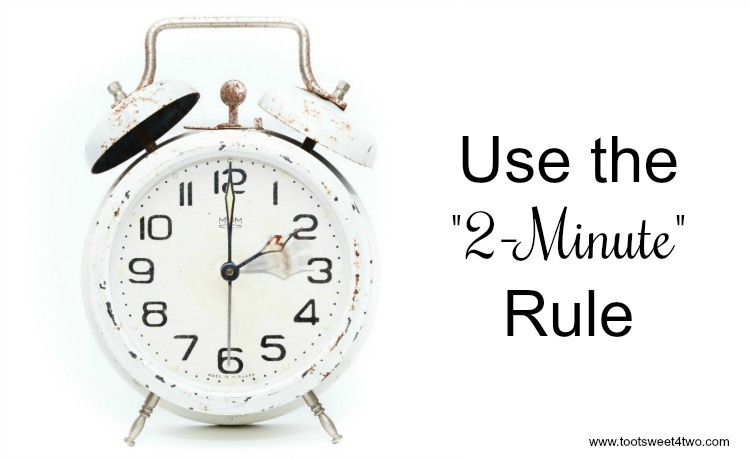 Alarm clock with text "Use the 2-Minute Rule"