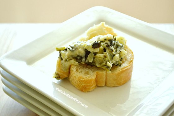 Cheesy Spinach and Artichoke Dip on baguette slice