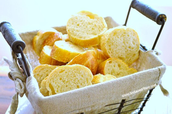 French baguette slices in a wire basket