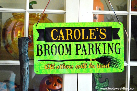 Close-up of Carole's Broom Parking sign