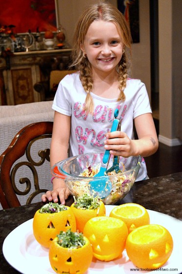 Princess P smiling and making Easy Jack-O-Lantern Salad Cups