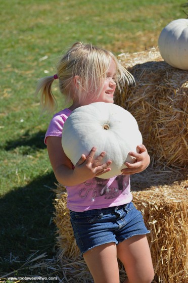 Princess Sweetie Pie carrying a white pumpkin