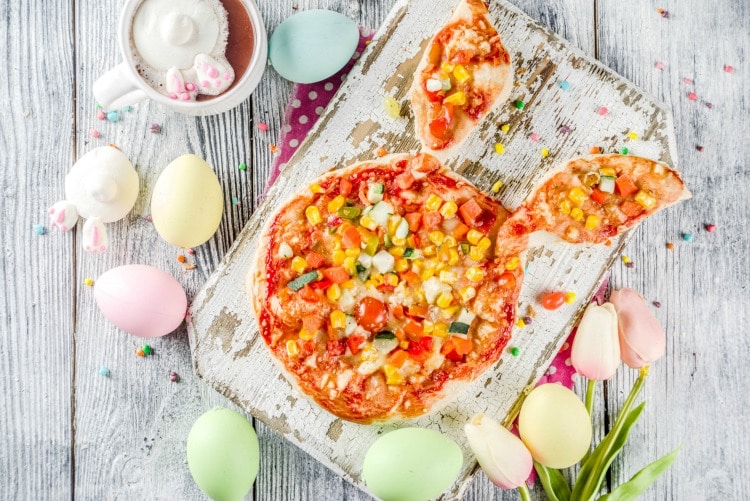 Celebrate Easter with an Easter Bunny Pizza on wooden cutting board