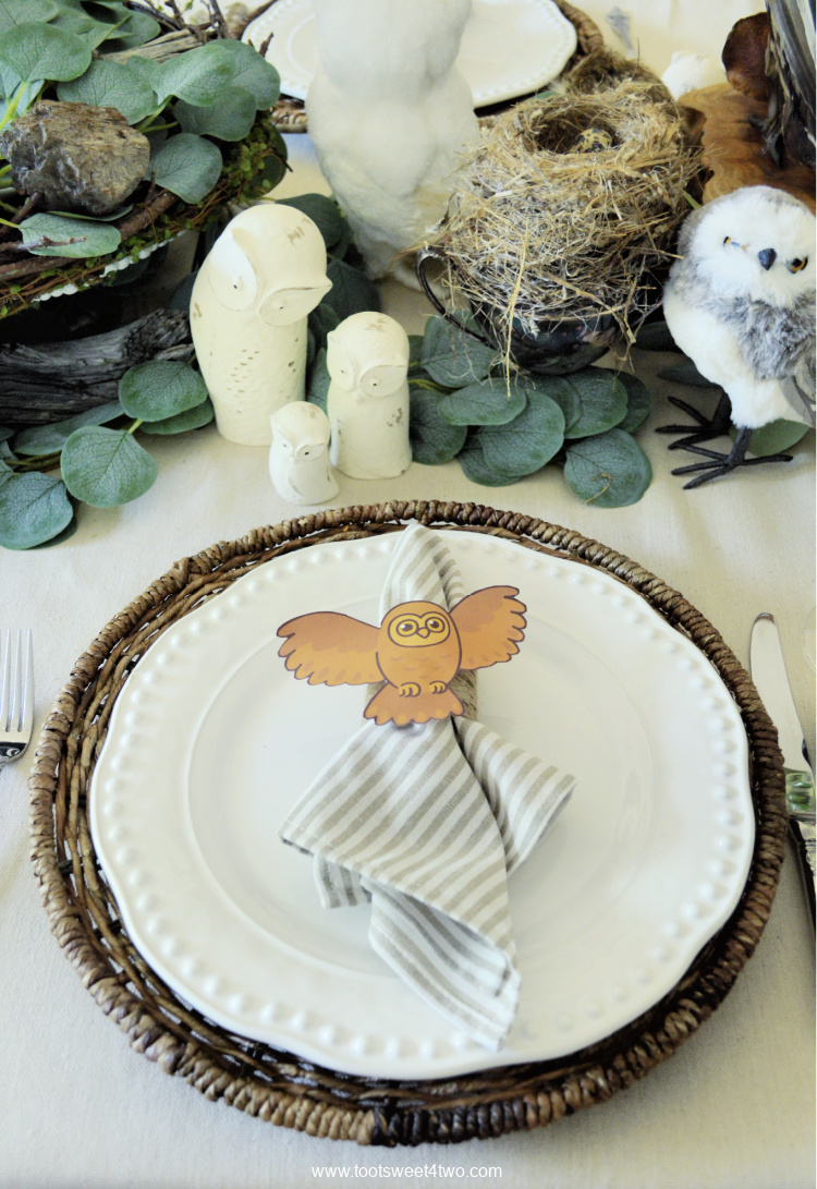 white ceramic owl table decor on a dining table