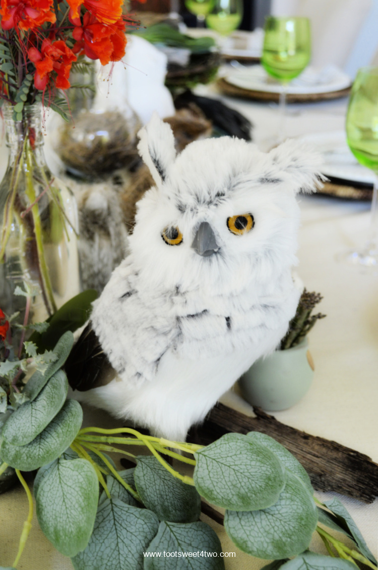 Cute stuffed gray owl on table