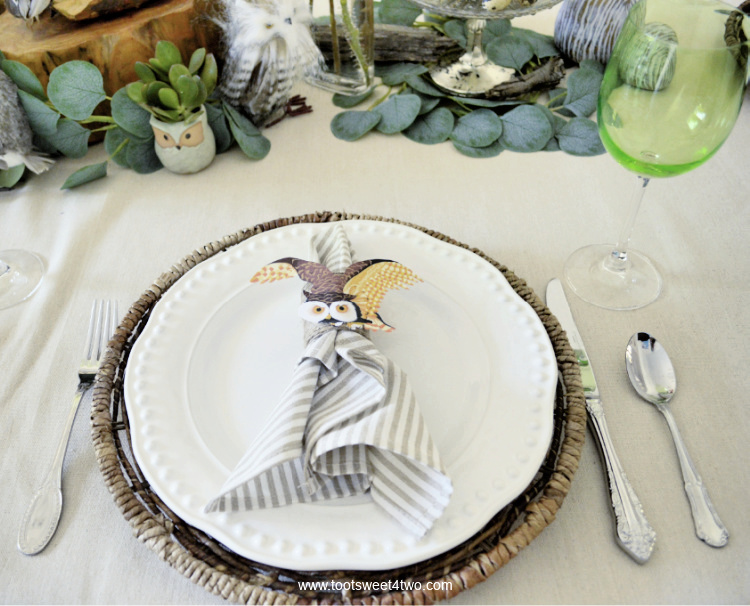 white-faced owl napkin ring on pretty dining table